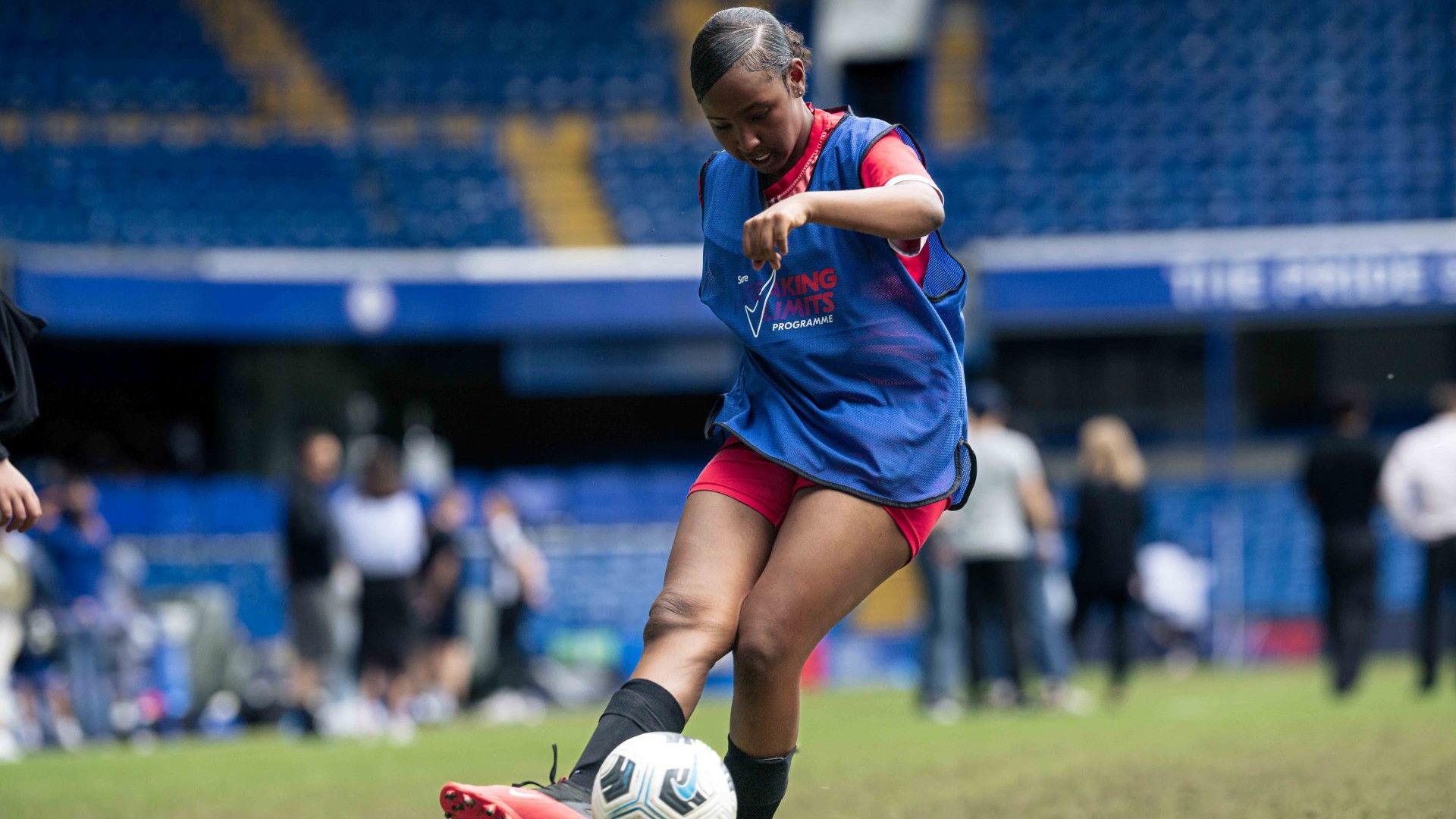 A young Black girl playing football as part of Rexona’s Breaking Limits inclusive advertising campaign.