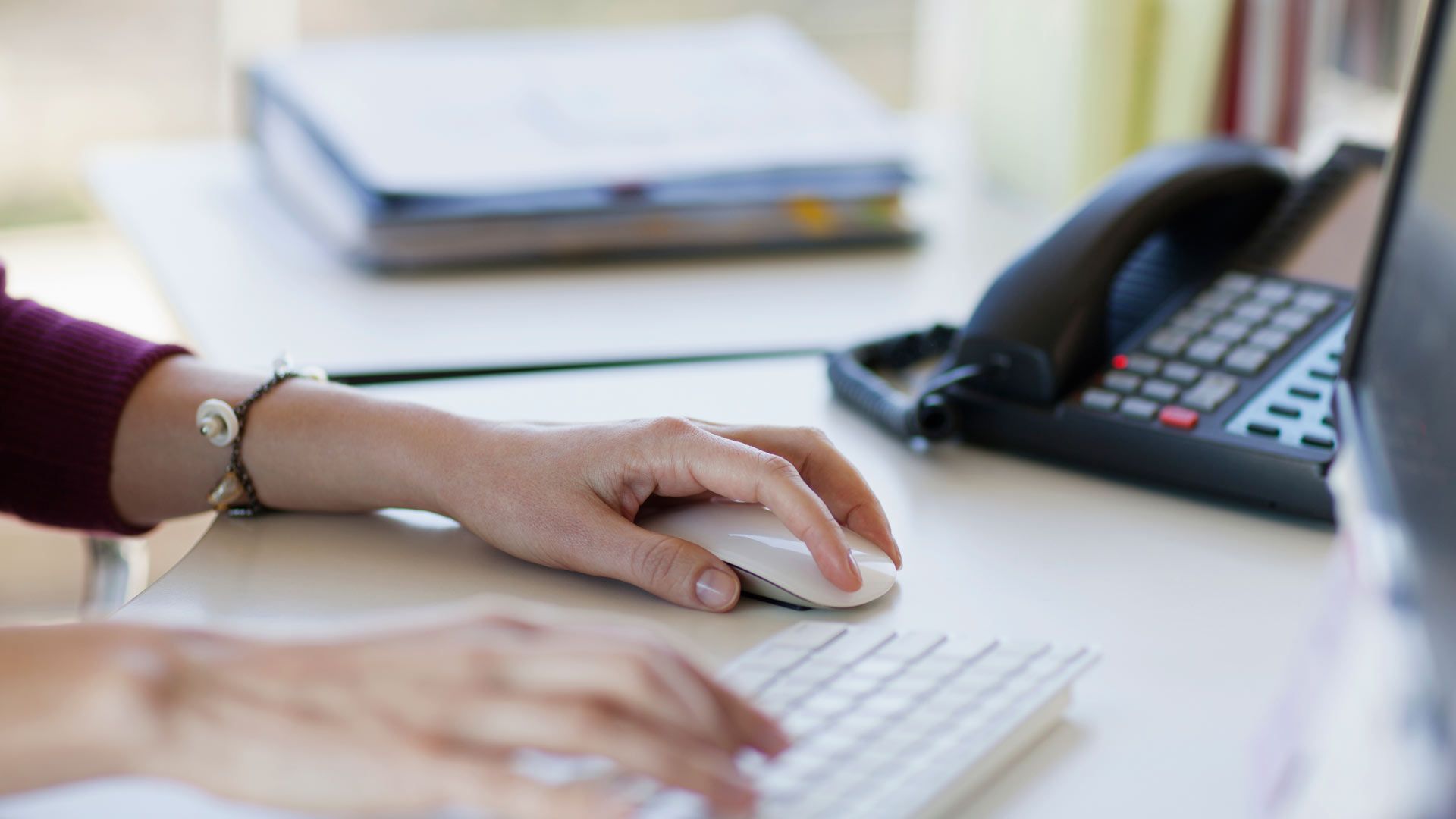 A person using a keyboard and mouse