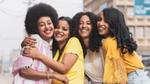 Four Ethiopian women with four different hairstyles comprising straight, curled, styled and natural hair.