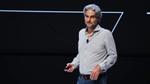 Alessandro Manfredi in jeans and a white shirt speaking on stage