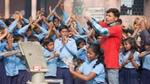 A group of schoolchildren washing their hands