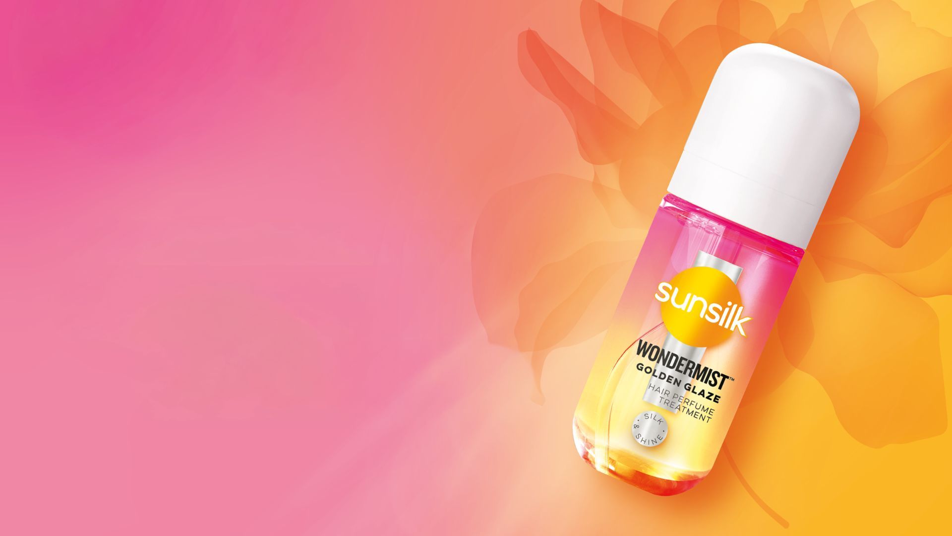 A Sunsilk Wondermist product bottle placed on a vibrant pink‑to‑orange gradient background with a soft, floral pattern.