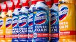 A selection of Domestos Power Foam products on a supermarket shelf.