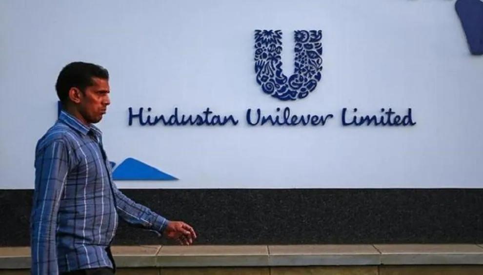 A man walking outside a Hindustan Unilever building