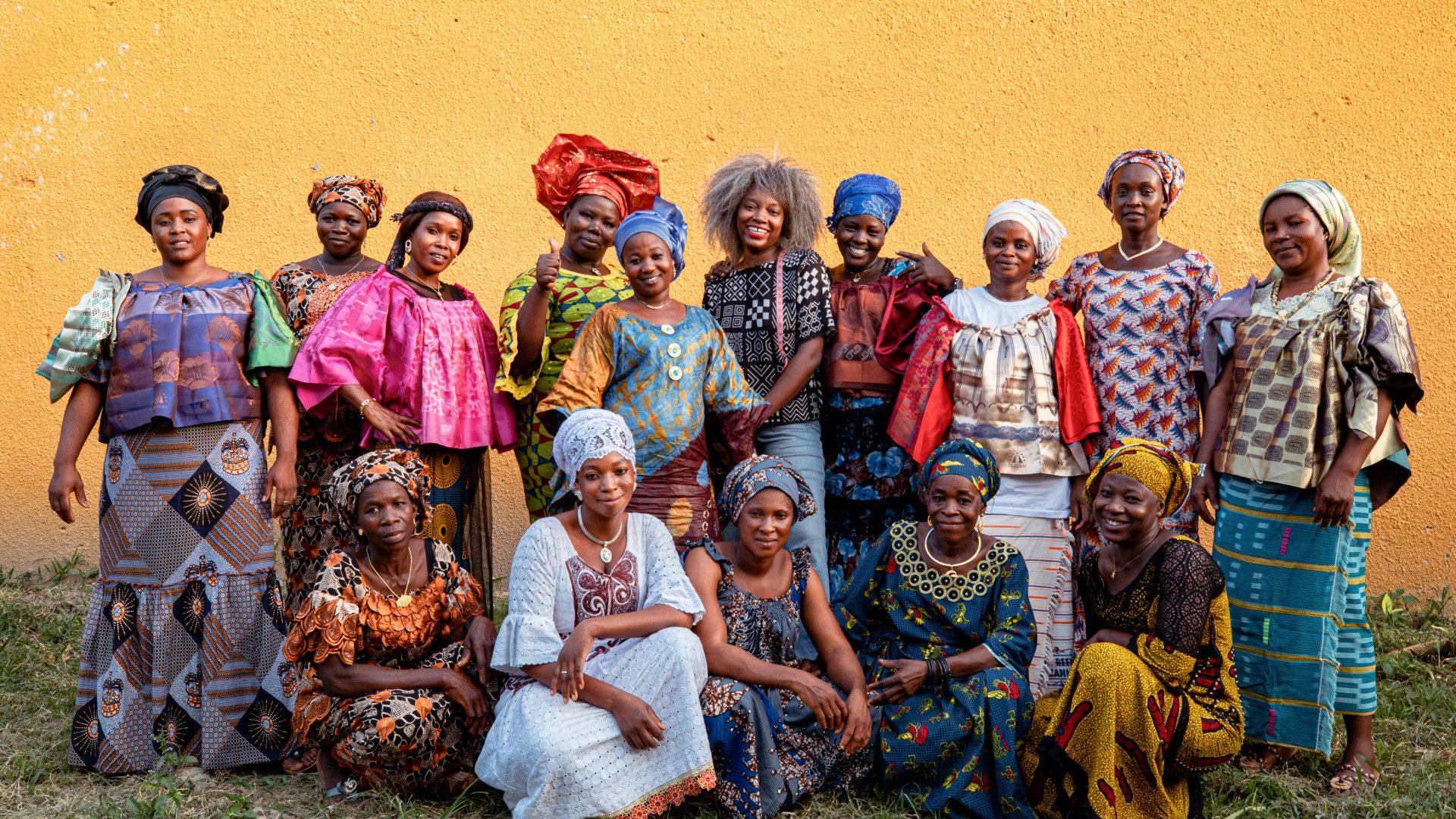 Two women holding their AWA by Magnum graduation certificates