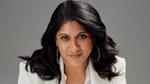 Priya Nair, CEO & Managing Director, Hindustan Unilever Limited. She has long dark wavy hair, is wearing a white suit and large hooped earrings.