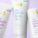 Three Dove ‘Whole Body Deo’ deodorant products displayed against a soft purple background. The products include two tubes labelled ‘invisible cream’ for odour control with vitamins – one coconut and vanilla scented and one unscented – and a white anti friction stick also in the coconut and vanilla scent. Each item features the Dove gold bird logo and clean, minimalist packaging.