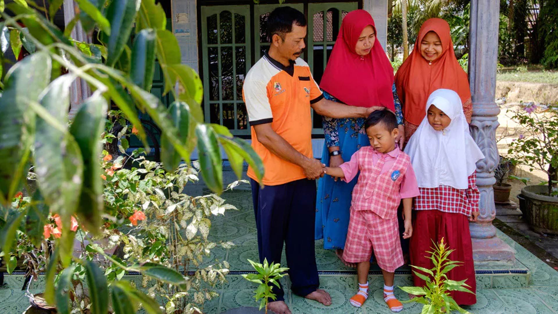 Indonesian farmer with his family