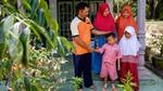 Indonesian farmer with his family
