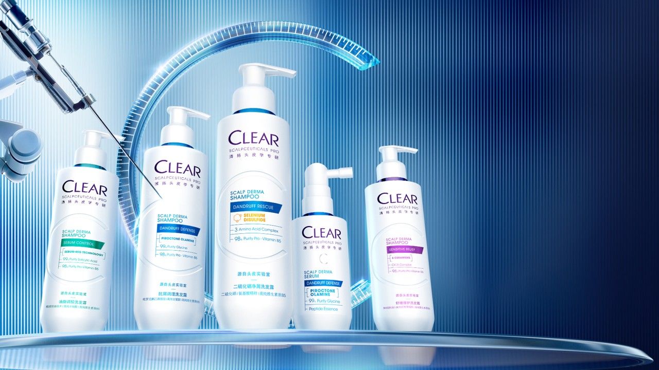 Five Clear scalp care products are displayed on a futuristic background.