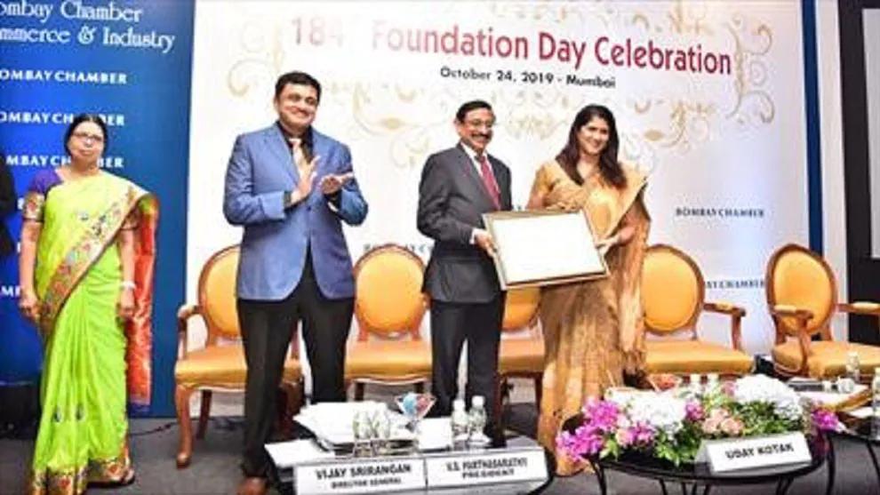 People standing on stage and smiling