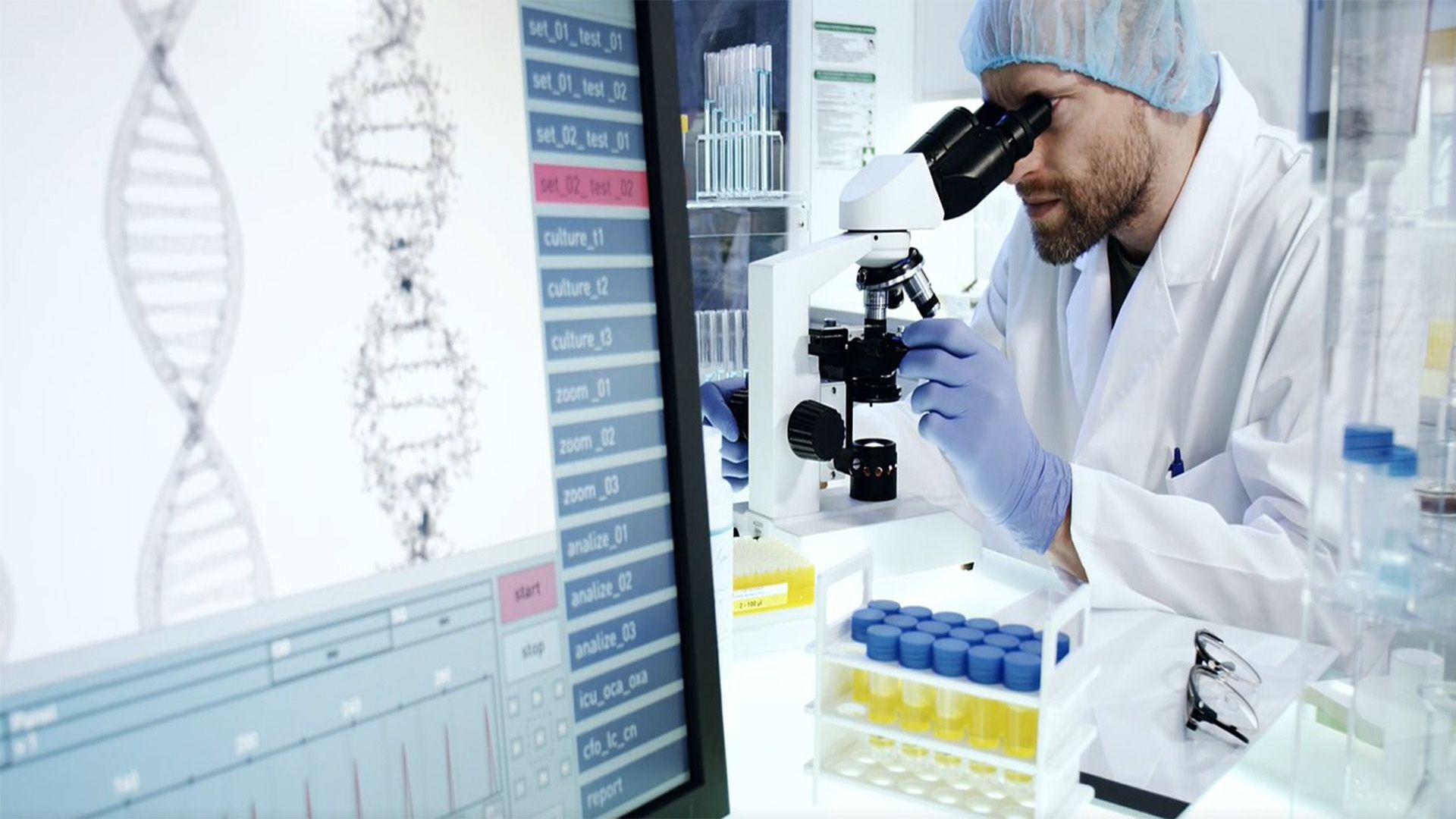 Scientist looking through microscope