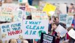 Image of children holding protest placards with Freedom to breathe on them