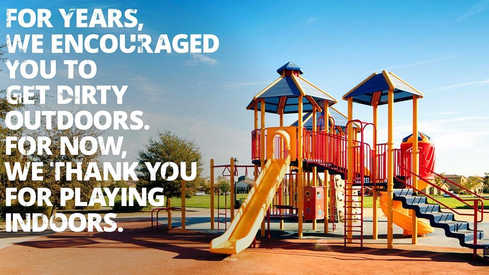 Advert showing children’s playground with treehouse and slide.