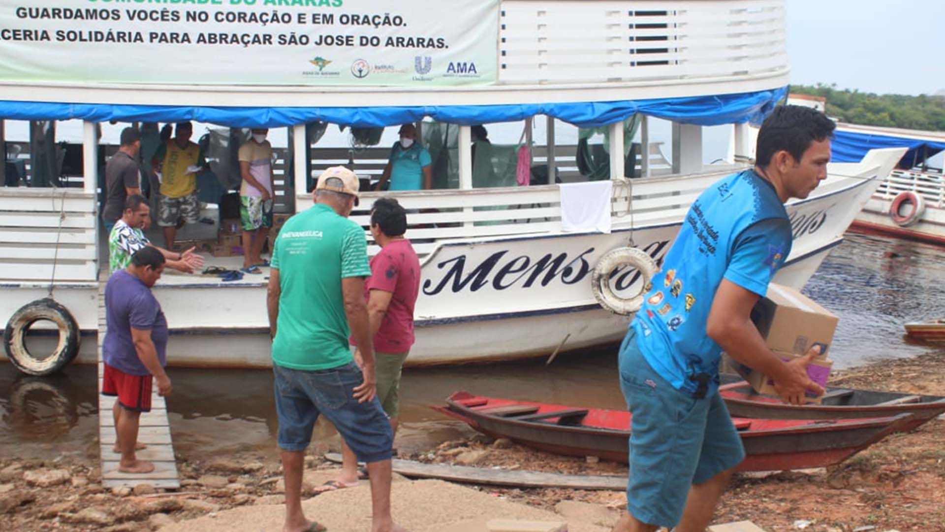 Boxes being unloaded from a riverboat
