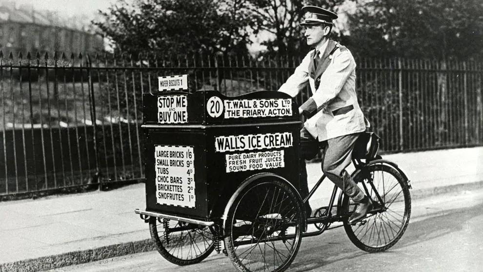 A Walls ice cream seller riding a bicycle