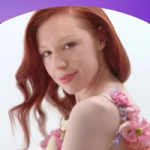 Unilever Q1 2026 results graphic on a blue‑to‑purple gradient background showing a person photographed against a light backdrop, wearing a floral‑detailed garment, positioned beneath a curved design element.