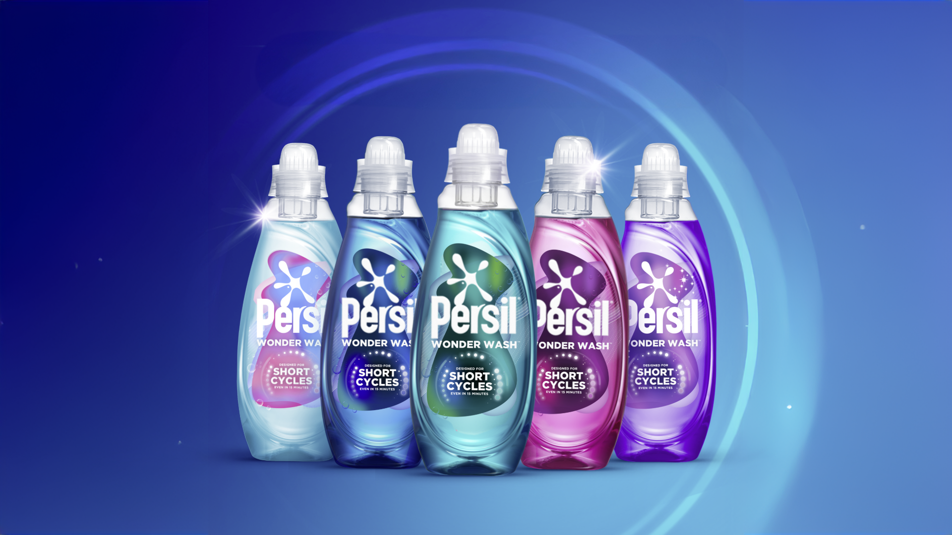 Five Persil Wonder Wash bottles on blue background.