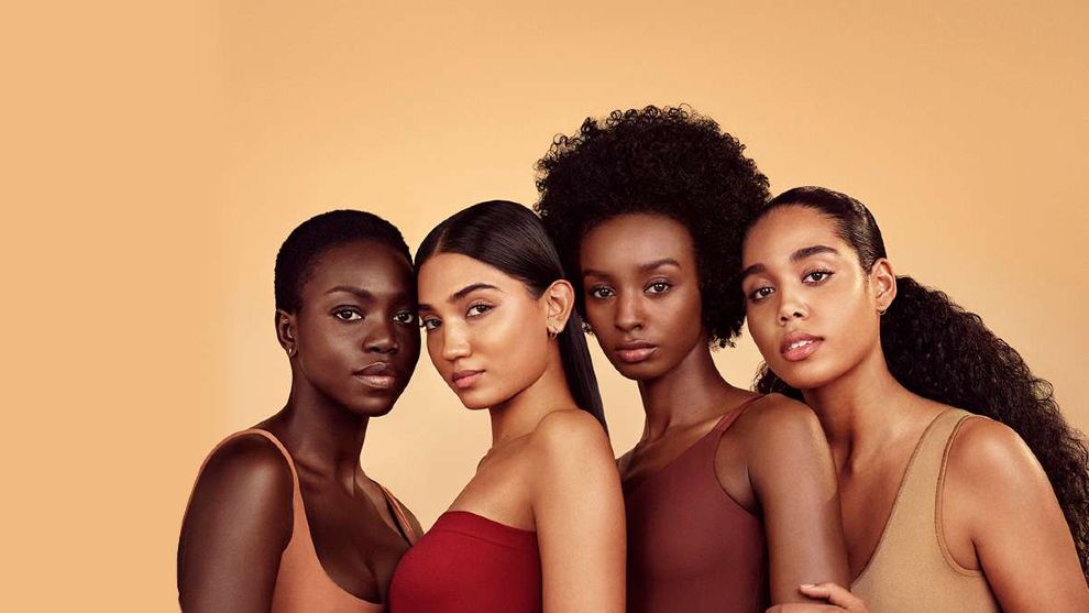 Four women standing in a row