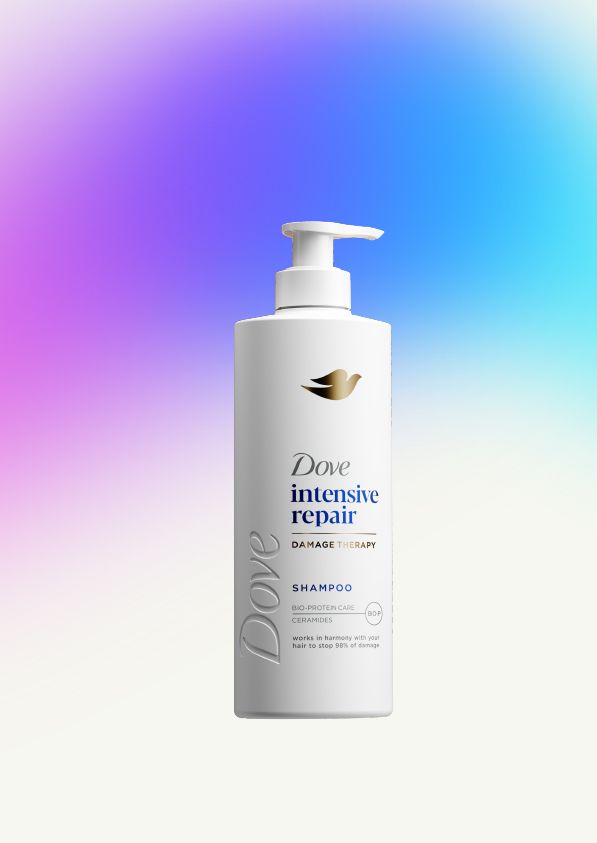 A bottle of Dove Intensive Repair shampoo with pump dispenser on a blue‑and‑purple gradient background.