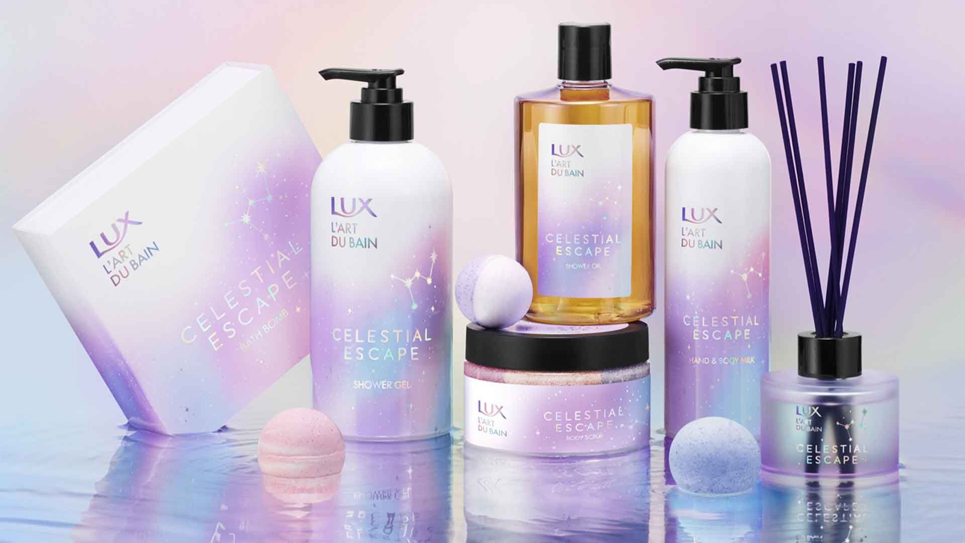 A collection of new LUX Celestial Escape products including shower gel, body scrub, shower oil and hand & body milk