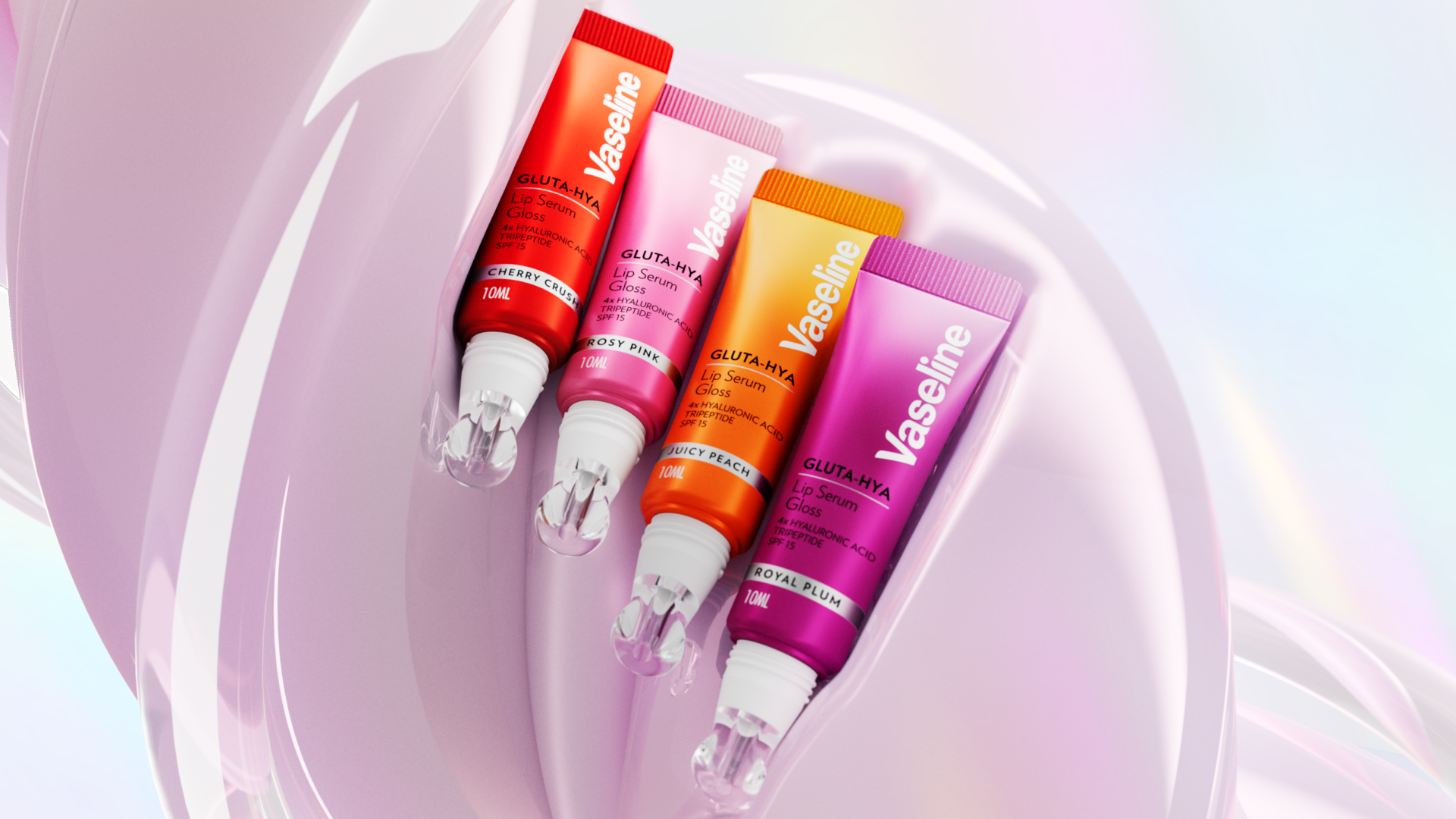 Four Vaseline Gluta Hya lip serum tubes in cherry crush, rosy pink, juicy peach and royal plum displayed against a glossy pink abstract background.