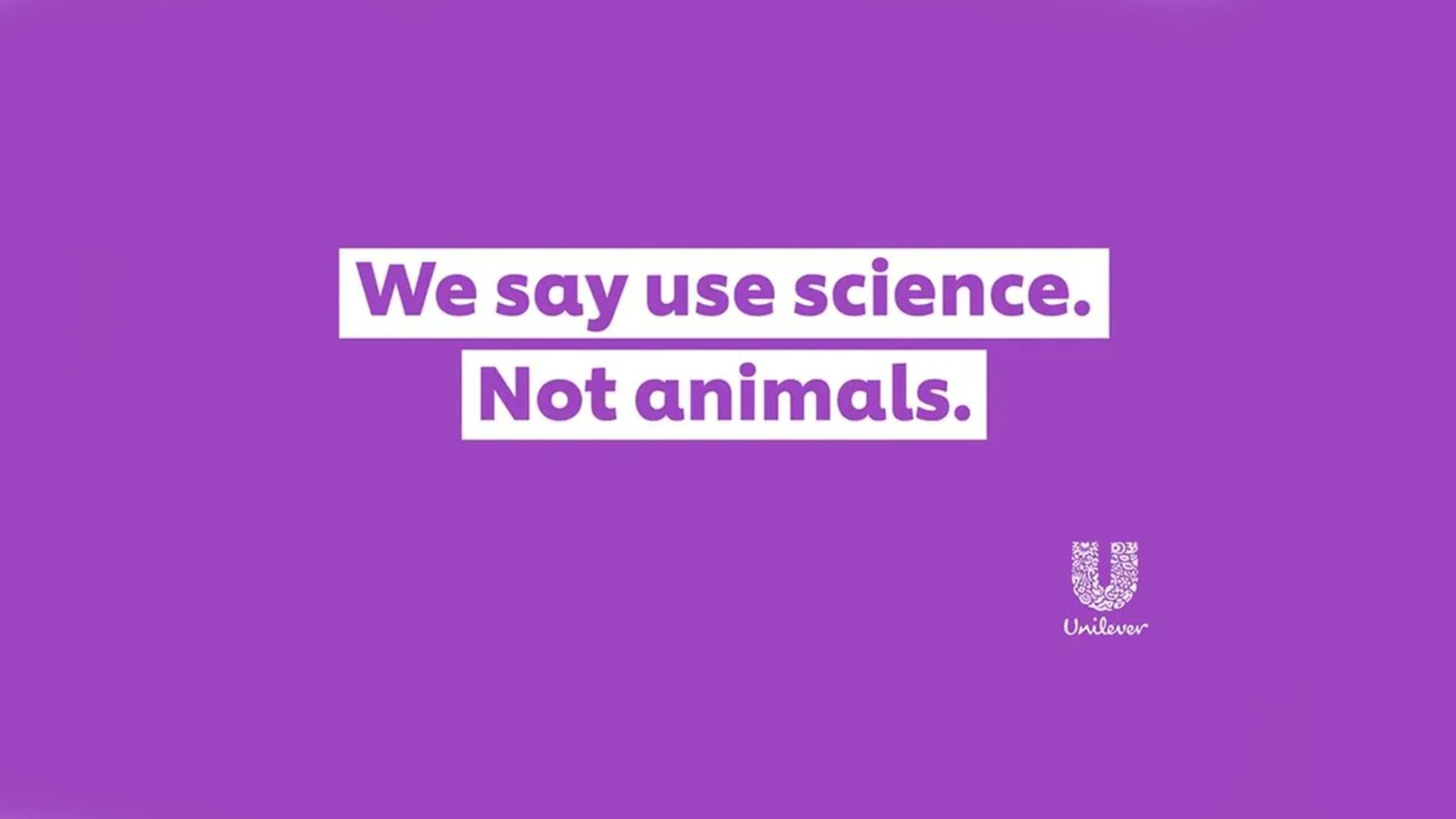 Purple background with a white Unilever logo and white text reading: We say use science, not animals. 