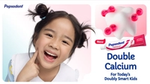 Pepsodent’s Double Calcium toothpaste campaign featuring the brand’s Smile design, a cartoon tooth and a girl smiling.