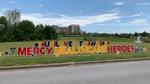 Sign erected in front of hospital, reading: ‘Unilever thanks Mercy Hospital Heroes’