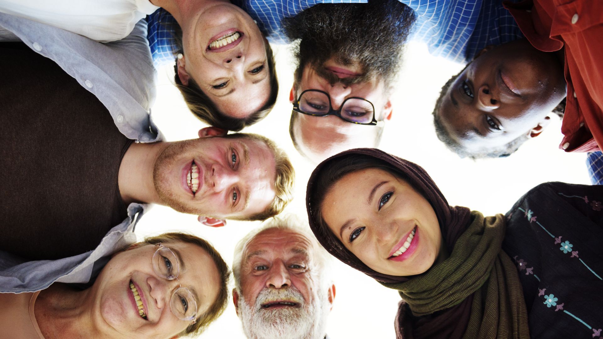 A diverse group of people smiling.