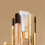 Hourglass makeup products on a beige background.