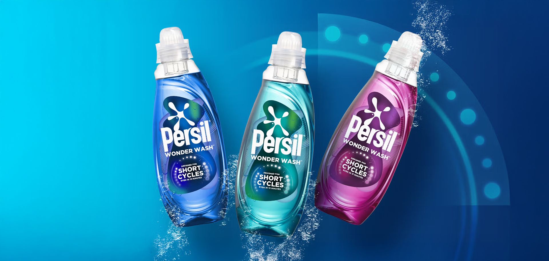 Three Persil Wonder Wash bottles in blue, teal, and purple displayed against a blue background with water splash effects.