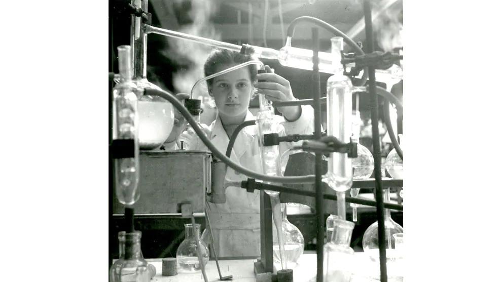 A young girl using science equipment