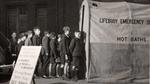 Children queueing for the Lifebuoy emergency hot water service
