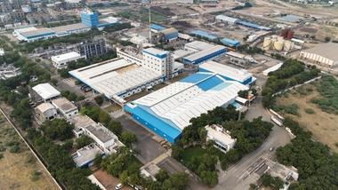 An aerial view of Unilever’s Gandhidham factory in India, a vast manufacturing facility in white and blue.