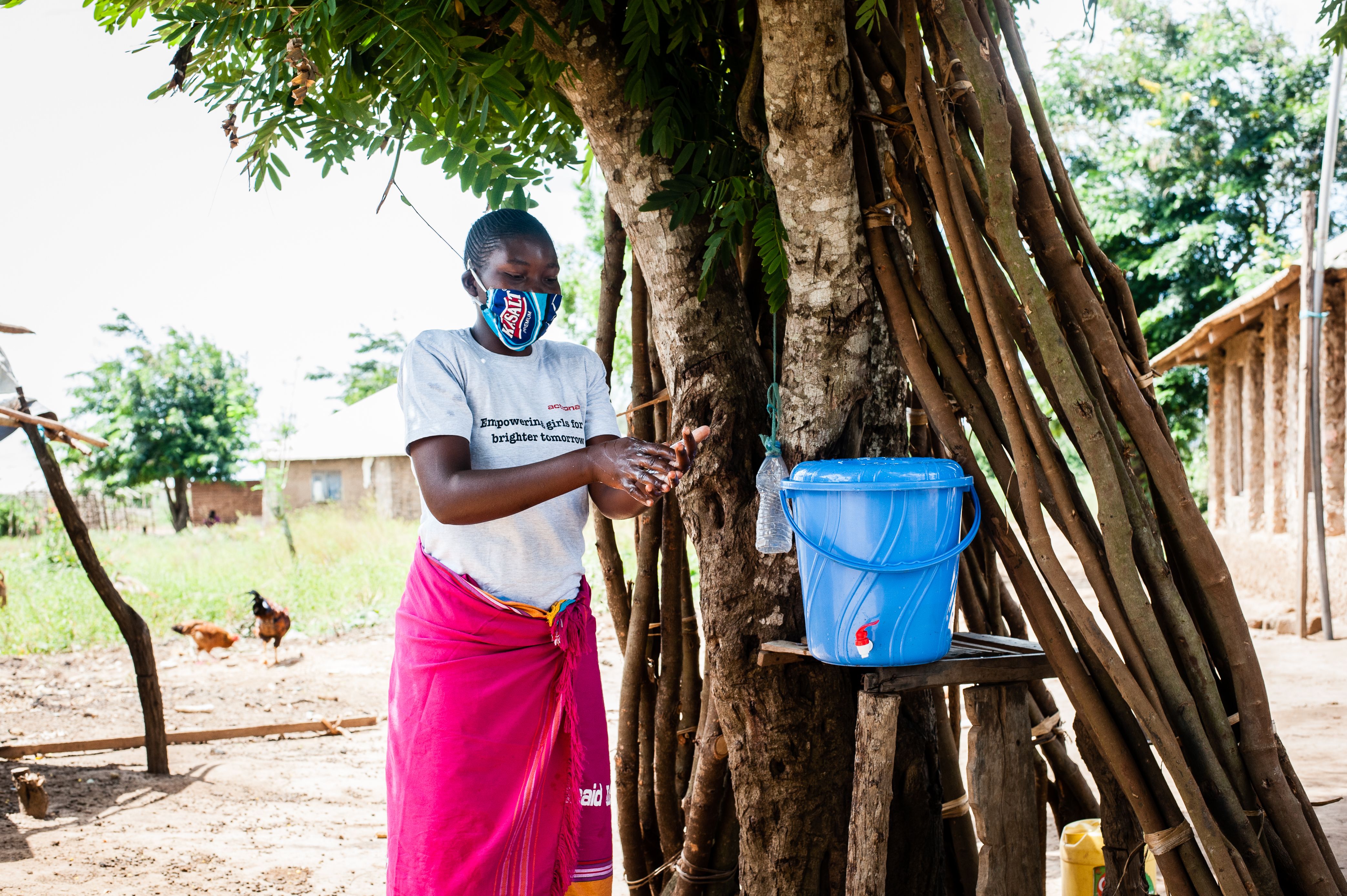 Woman washing her hands outdoors