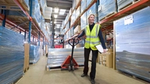 Photo of female warehouse worker in factory