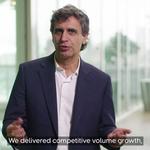 Fernando Fernandez, Unilever Chief Executive Officer, wearing a dark blazer and white shirt standing indoors in front of large windows.