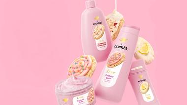 Promotional banner for a limited-edition Dove x Crumbl collaboration. The image features a pink background with cookie visuals and Dove-branded personal care products.