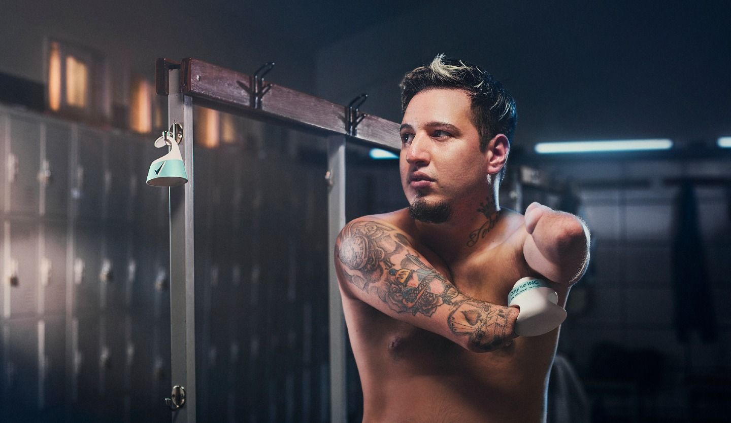 A photo of a man using Degree Inclusive deodorant.