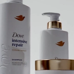 Three different products from the Dove intensive repair range with a white background.