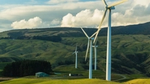 Wind turbines in front of hills