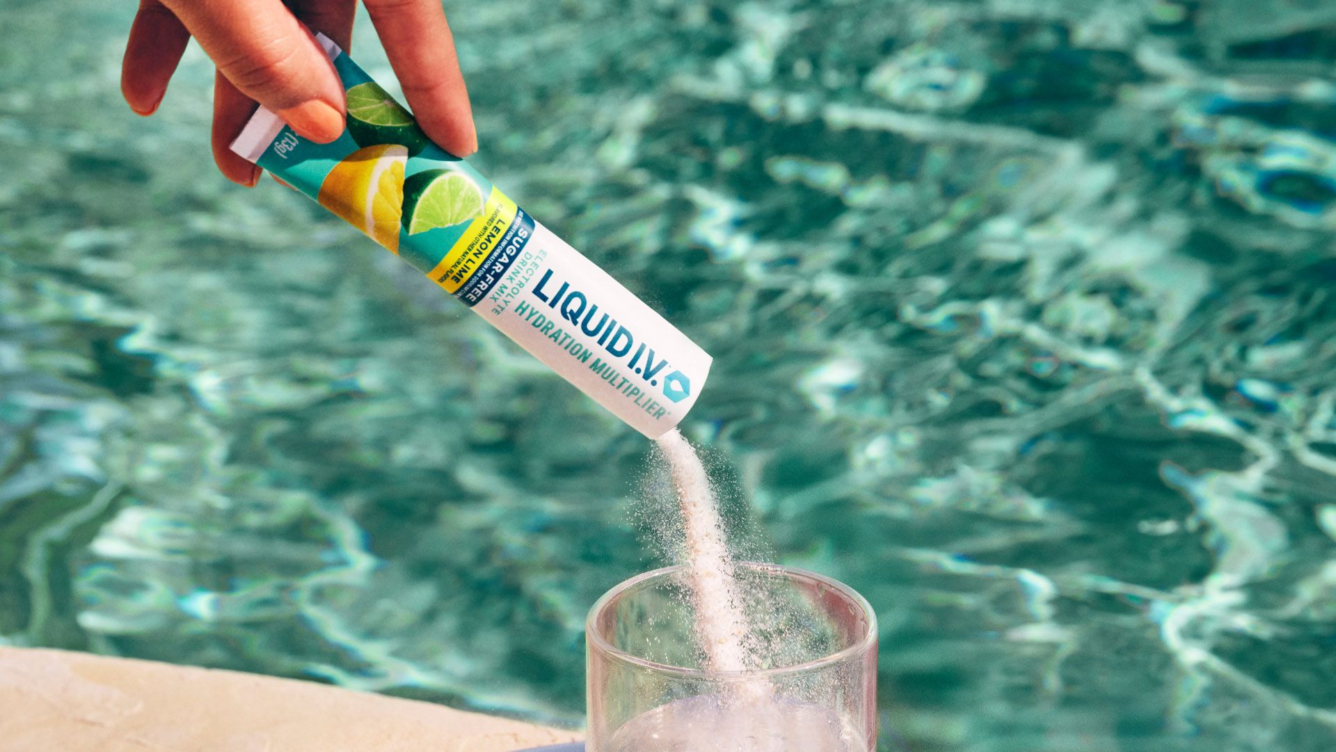 A packet of Unilever’s Liquid I.V. Hydration Multiplier being poured into a glass of water.