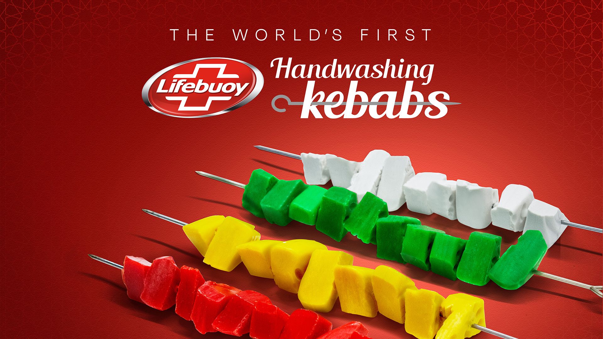 A row of four ‘kebabs’ threaded with different coloured pieces of soap – one each of red, yellow, green and white. The text above the image states: “The world’s first handwashing kebabs”.