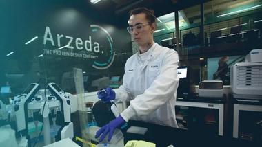An image of a man working in a laboratory at Arzeda