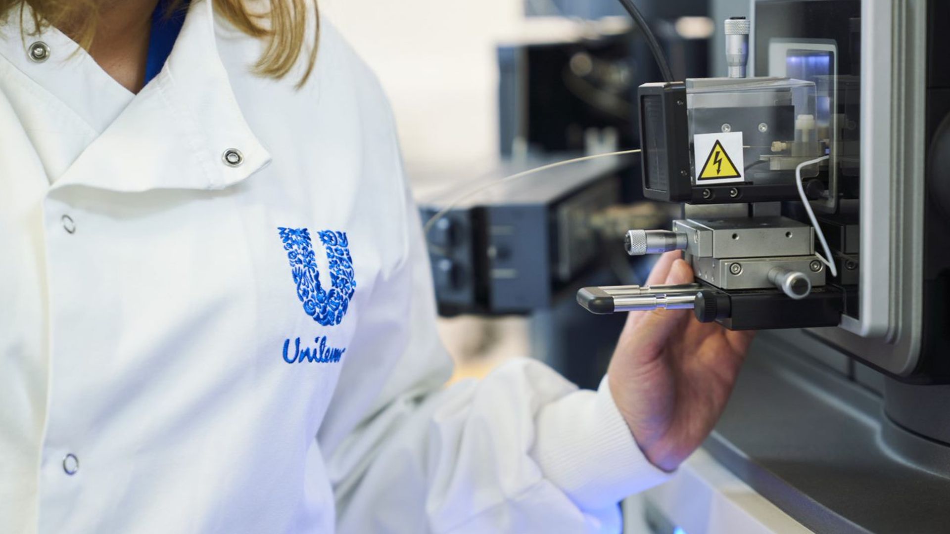 Unilever employee using scientific machinery. 